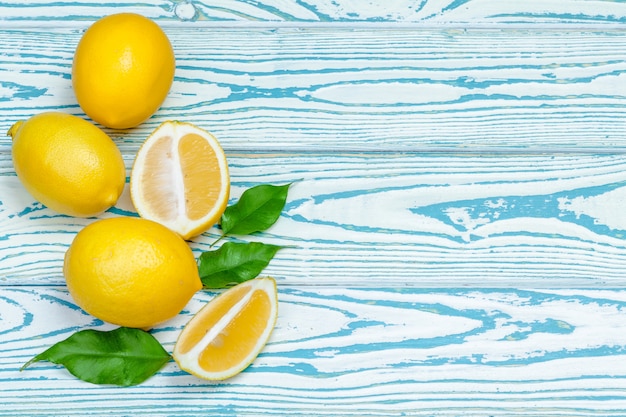 Fresh lemons on wooden table