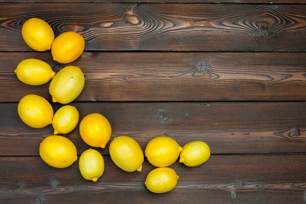 Fresh lemons on wooden table