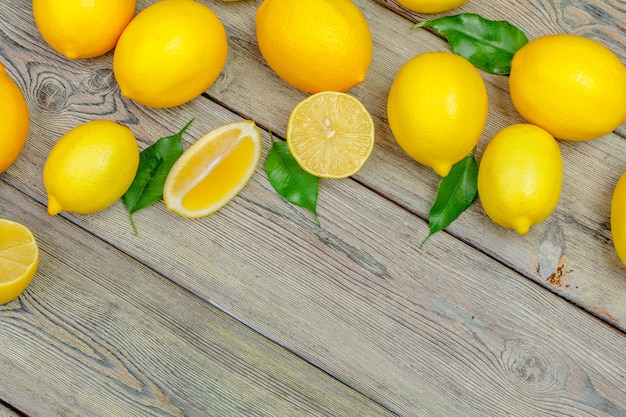 Fresh lemons on wooden table.