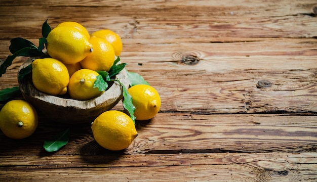 Fresh lemons on a wooden table