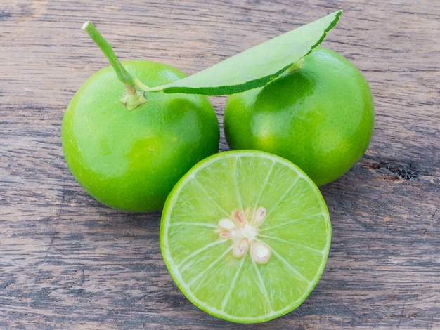  fresh lemons on wooden table