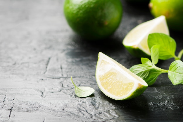 Fresh lime and mint on the black table