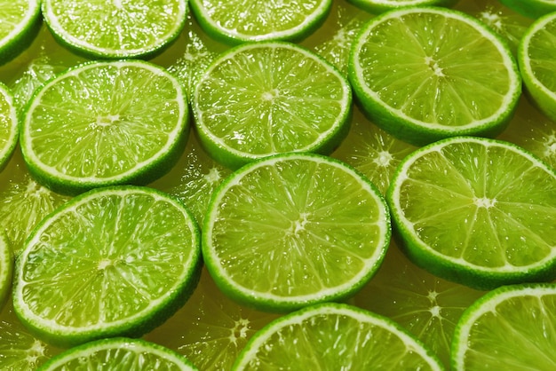 Fresh lime slices as a background.