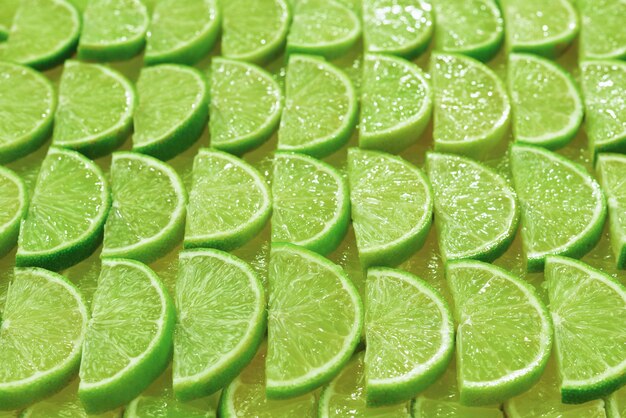 Fresh lime slices as a background.