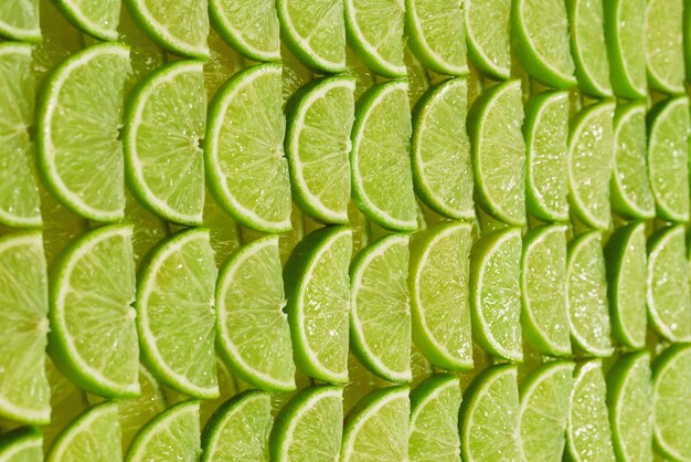 Fresh lime slices as a background.