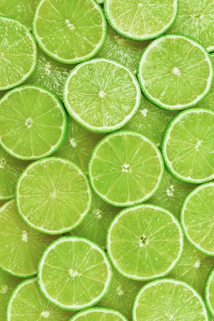 Photo fresh lime slices as a background.