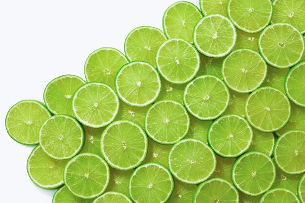 Fresh lime slices as a background.