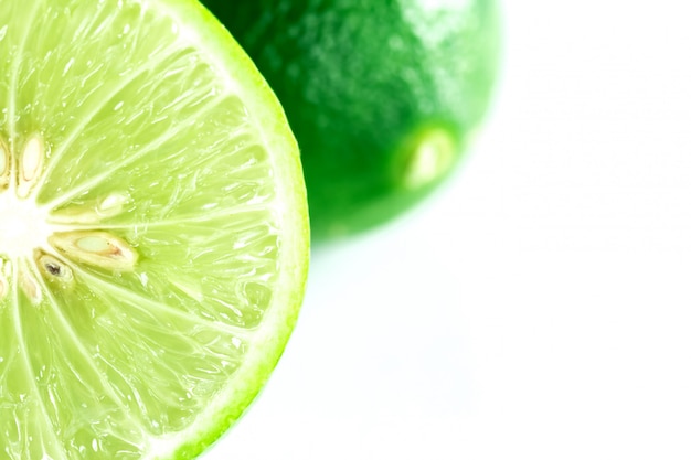 Fresh lime on white surface isolated image