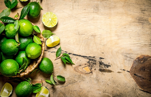 Fresh limes with leaves in the basket