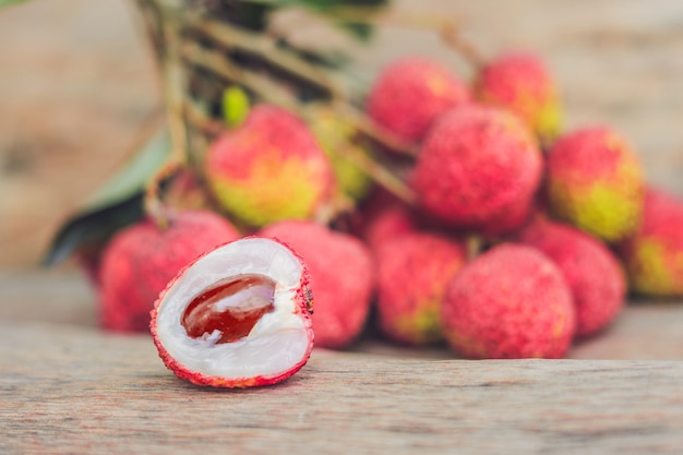 Fresh litchi fruit on an old wooden table