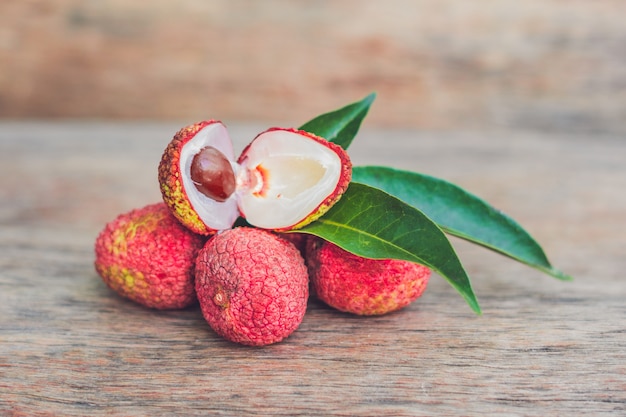 Fresh litchi fruit on an old wooden table