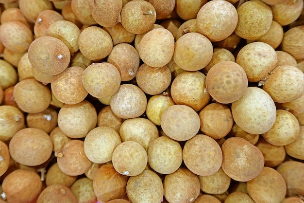 fresh longan fruits on top view as background