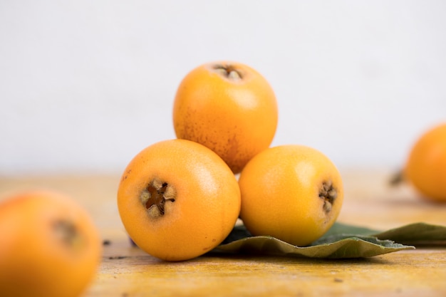 Fresh loquats on wooden table