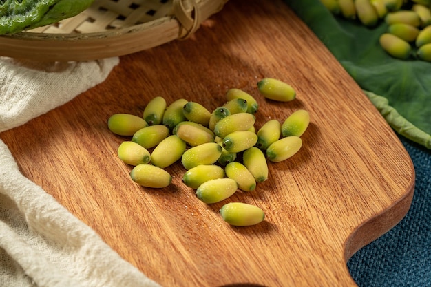 Fresh lotus seeds on a simple background