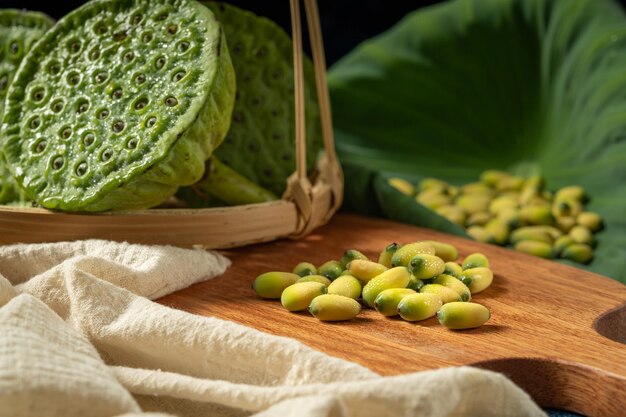 Fresh lotus seeds on a simple background