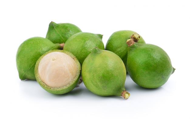 Fresh macadamia nut on a white wall