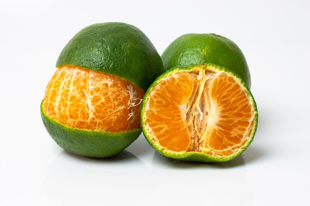 Fresh mandarin fruit or tangerines on white