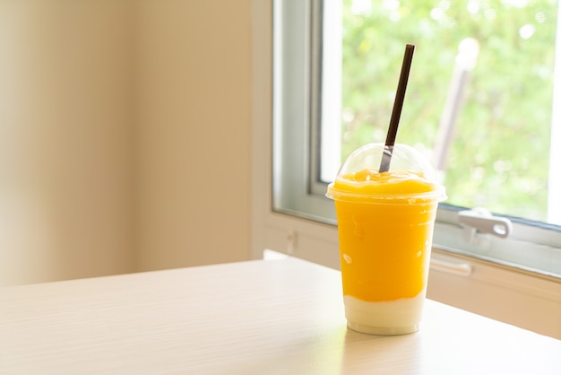 fresh mango fruit smoothies with yogurt glass