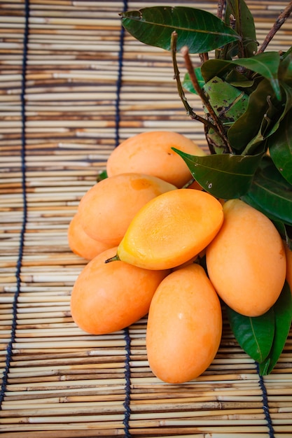 Fresh marian plum on wood background