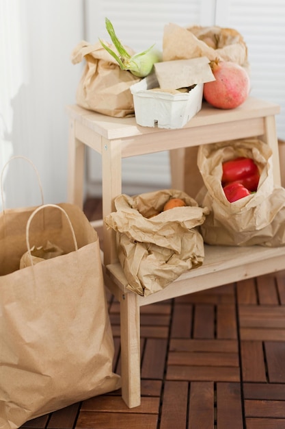 Fresh market delivery fruits and vegetables in a craft paper bags