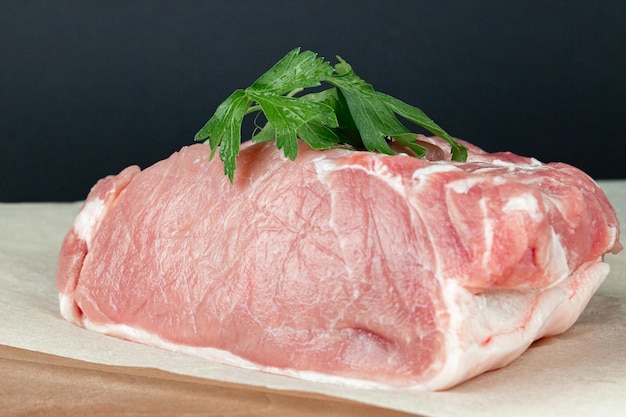 Fresh meat on dark background Raw beef steak and spices for cooking on kitchen cutting board Raw pork chops of meat