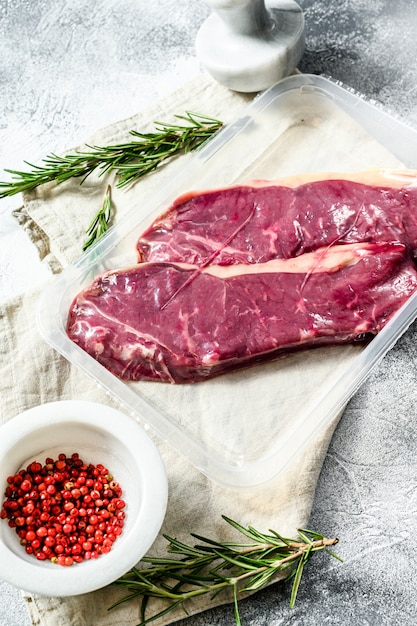 Fresh meat, vacuum-Packed marbled beef,  strip loin steak. Packaging from super market