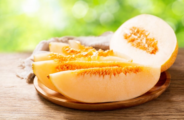 Fresh melon slices on a wooden board