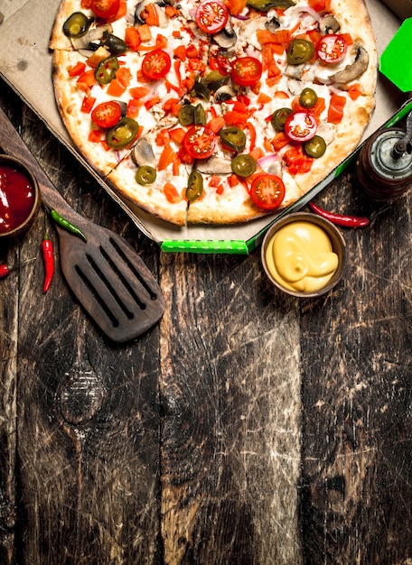 Fresh mexican pizza on wooden table