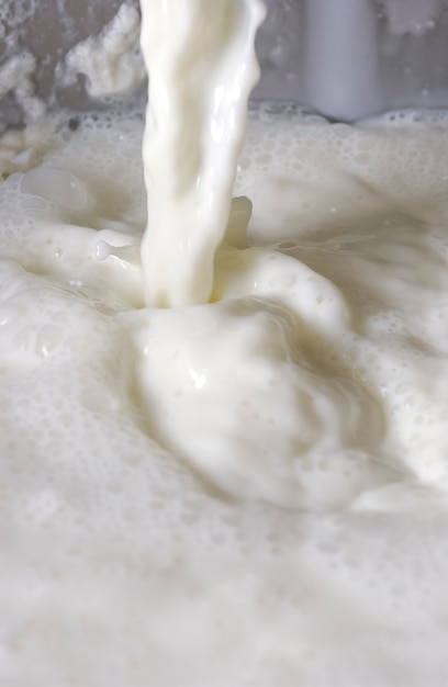 Fresh milk. Bubbles forming scene background.