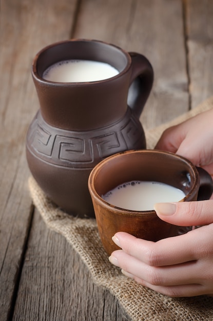 Fresh milk in a clay pitcher.