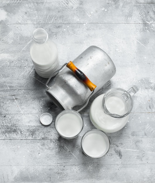 Fresh milk in glasses with a can