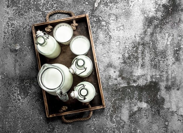 Fresh milk in an old box. On a rustic background.