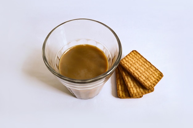 Fresh milk Tea with Biscuits on White Background