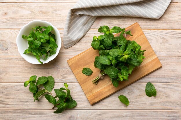 Fresh mint on Cutting board table top view Flat lay Space for text