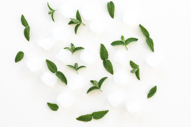 fresh mint leaves and ice cubes isolated on white background top view flat lay