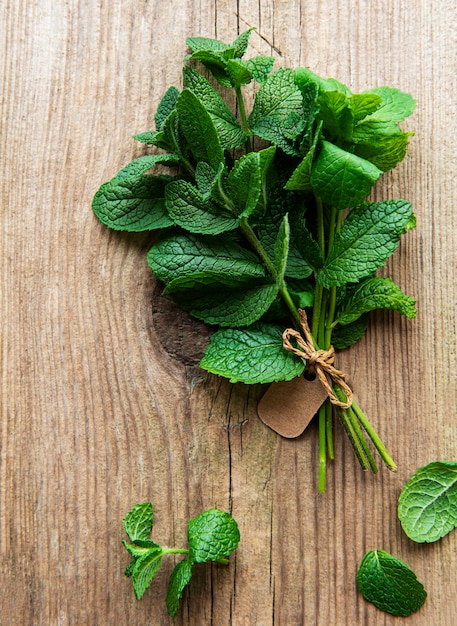 Fresh mint leaves on old wooden