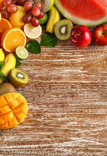 fresh mixed fruits on rustic wooden with copy space