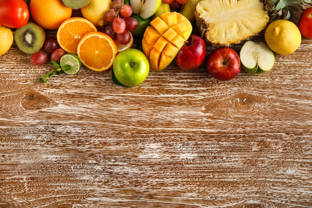 fresh mixed fruits on rustic wooden with copy space