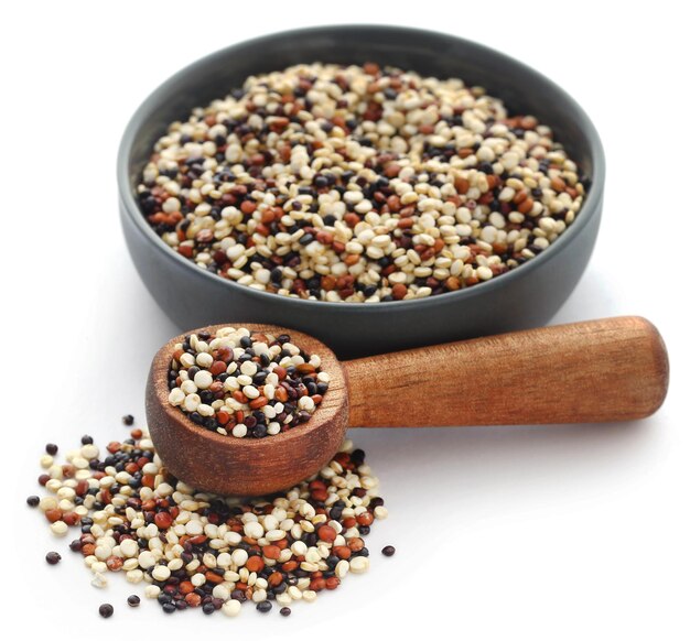 Fresh mixed quinoa over white background