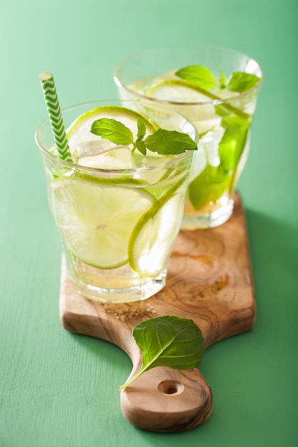 Fresh mojito cocktail over green table