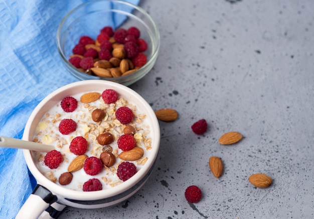 Fresh muesli with nuts and raspberries