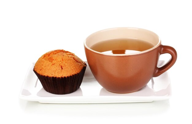 Fresh muffin with tea isolated on white