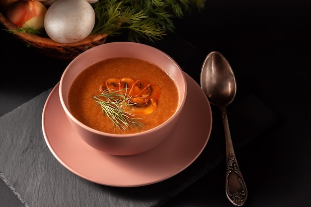 Fresh mushroom puree soup with vegetables, dill and toast