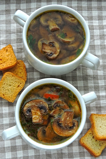 Fresh mushroom soup with crackers.