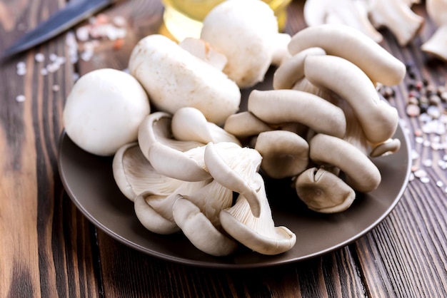 Fresh mushrooms on a wooden background