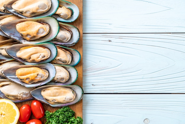 fresh mussel on wood board