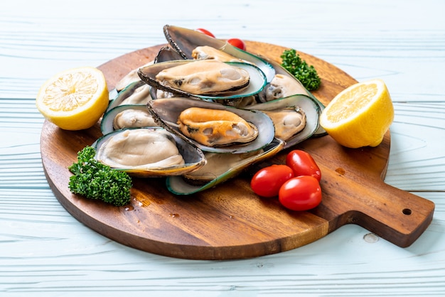 fresh mussel on wood board