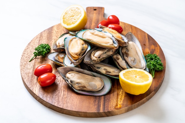 fresh mussel on wood board