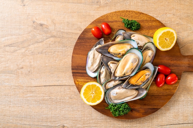 fresh mussel on wood board