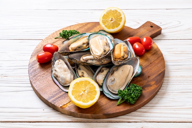 fresh mussel on wood board